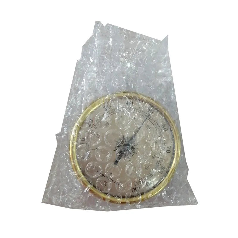 Analogue thermometer and hygrometer with aluminium outer ring and dial showing temperature and humidity scales