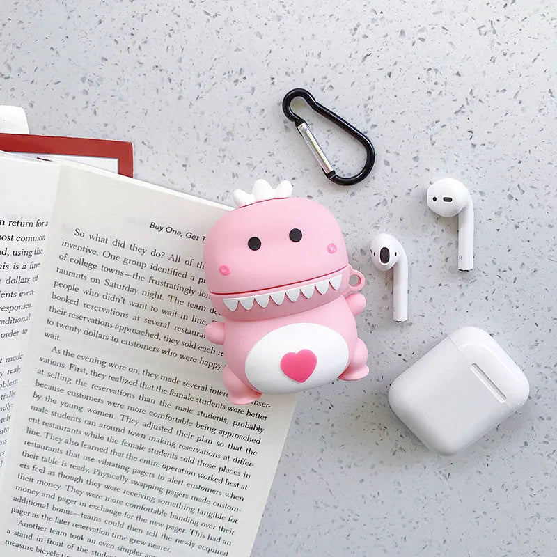 Green silicone AirPods case with raised cartoon animal design, showing charging port cutout.