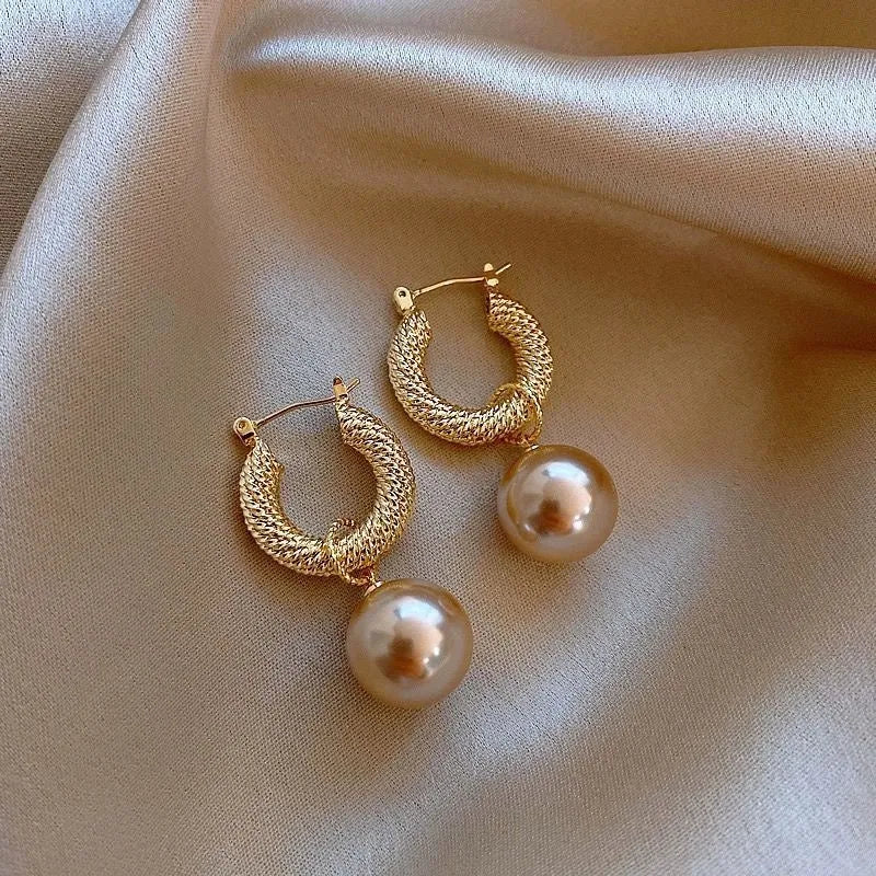 Geometric copper women's earrings with zircon accents and rose design elements in multiple colour variations