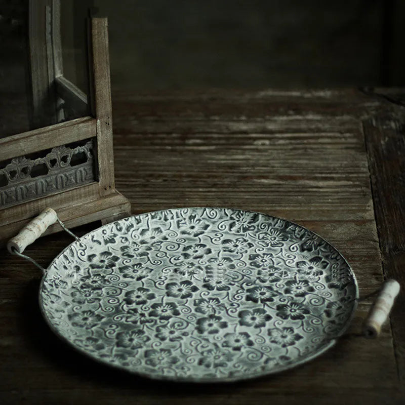 Round wrought iron storage tray in two sizes for organising jewellery or household items.