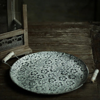Round wrought iron storage tray in two sizes for organising jewellery or household items.