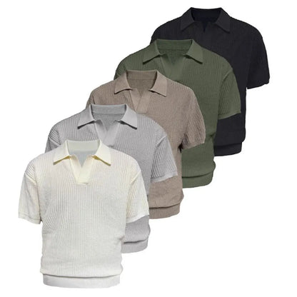Short sleeve men's polo shirt in grey with striped collar, shown on a hanger.