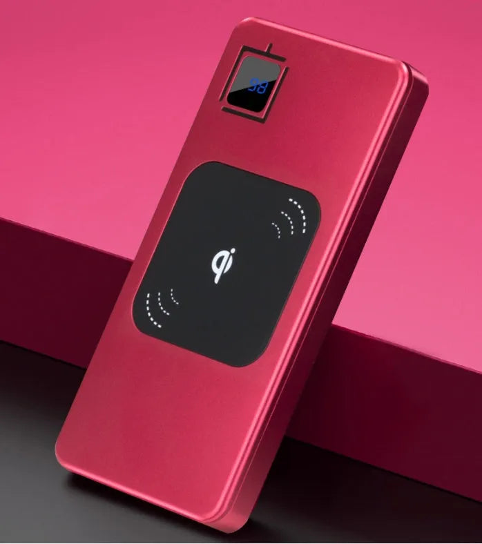 Slim black alloy power bank with LCD screen showing battery percentage, next to a smartphone.