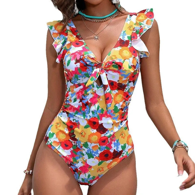 Women's printed one-piece swimsuit in polyester fabric, shown in picture colour.