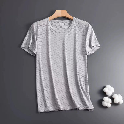 Man wearing a solid colour ice silk short sleeve t-shirt with a crew neck in a loose, casual fit for summer.