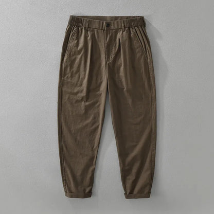 Men's loose-fit straight-leg trousers in a cotton linen blend, shown in a raw jute colour.