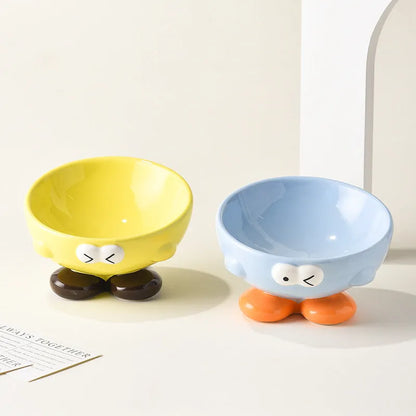 Ceramic slanted pet bowl with decorative expression pattern in blue colour