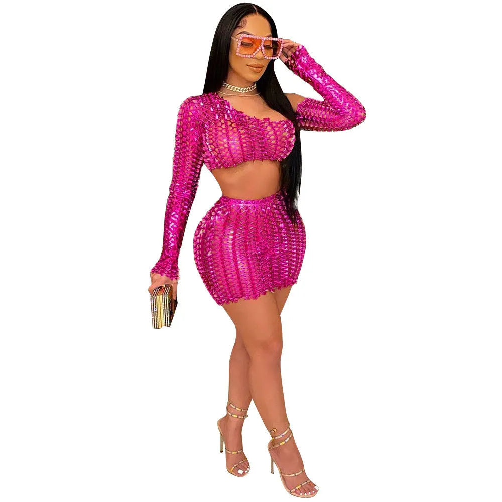 Women's black hollow-out two-piece set with sleeveless top and short skirt on a model.