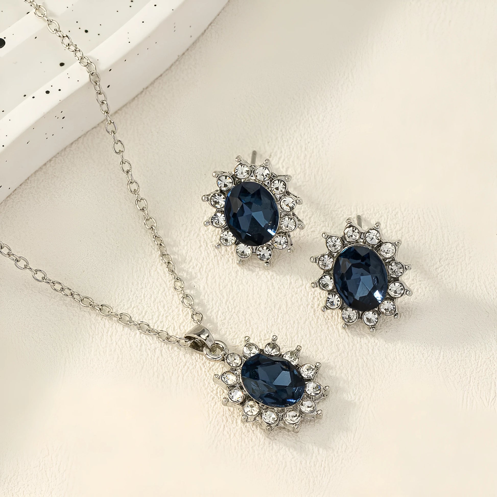 Sunflower zircon necklace and earring set in alloy with electroplated finish showing ellipse-shaped design