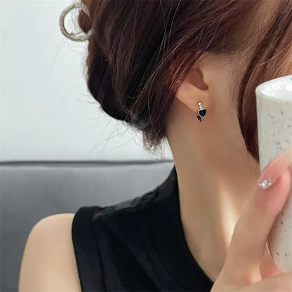 Black love heart earrings for women with alloy construction and ear clip design