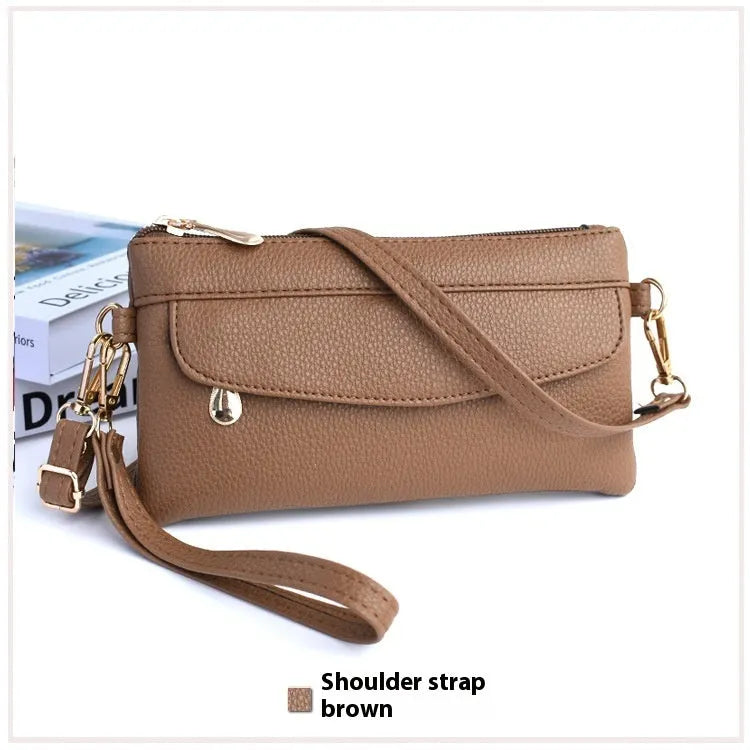 Soft surface square PU crossbody bag and clutch with internal zipper pocket in various colours.