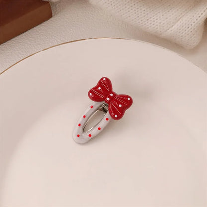 Red love heart-shaped hair barrette clip with retro white dots on a willow leaf-shaped base.