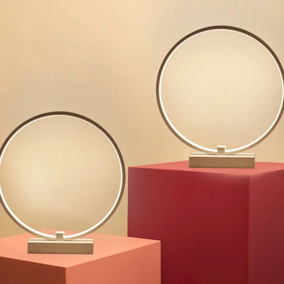 Modern 25cm diameter white LED bedside lamp with acrylic frame and iron base, emitting cool or warm white flicker-free light