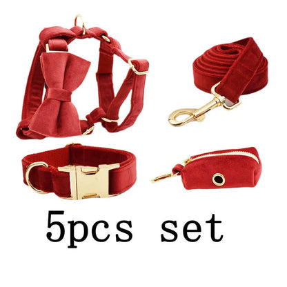 Cloth dog collar set with matching leash, bow tie, vest, and poop bag accessories