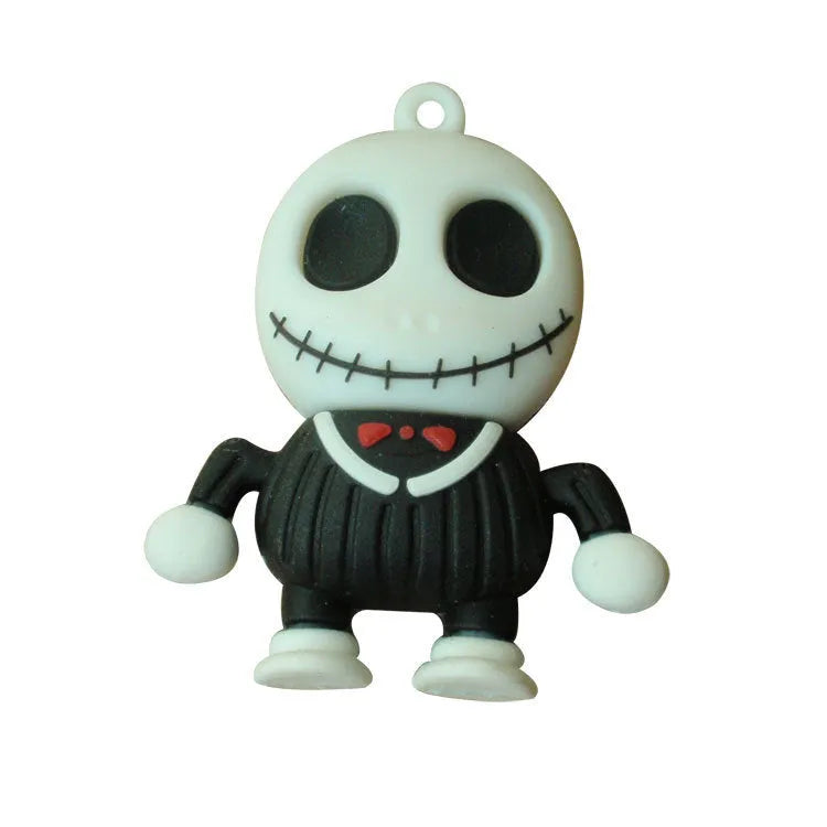 Skull-shaped black USB flash drive on a small metal keychain against a dark background.