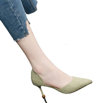 Women's black pointed toe stiletto heel sandals on a white background.