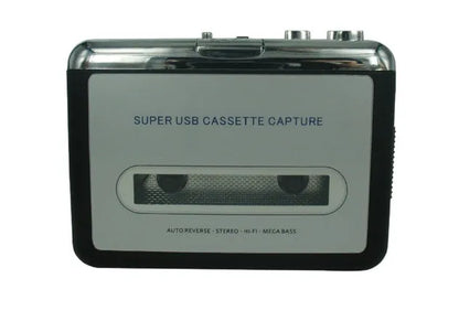 Cassette to MP3 converter unit with USB cable on a desk next to a cassette tape