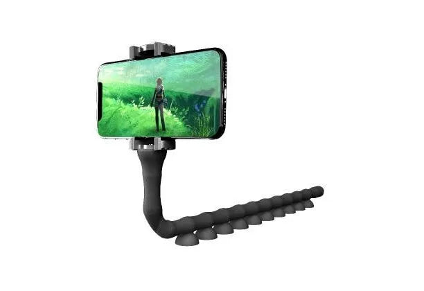 Black flexible rubber phone holder with suction cup extended on a desktop