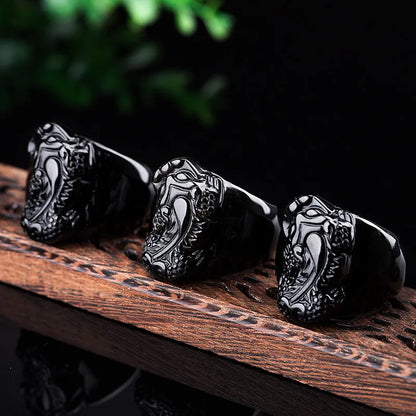 Men's gold sheen obsidian Pixiu thumb ring with alloy band in size 19, 20, 21, or 22.
