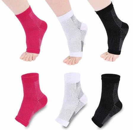 Anti-fatigue compression foot sleeve in black, red, or white, featuring moisture-wicking fabric and a heel hole for breathability.