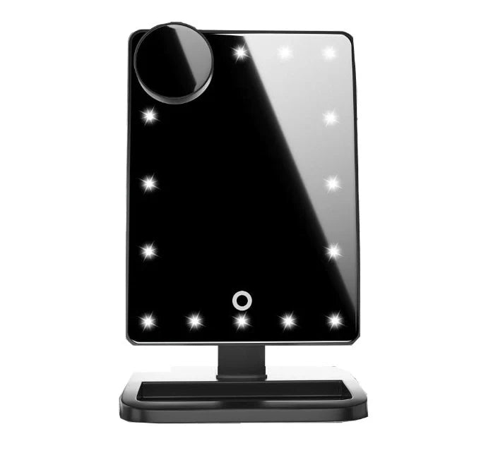 Pink touch screen makeup mirror with LED lights and Bluetooth speaker showing 10X magnification section