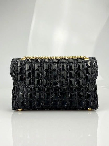 Silver rhinestone-decorated PU leather clutch bag with a metal chain strap, shown open to reveal interior phone pocket.