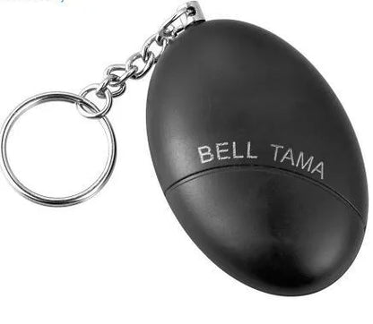 Compact black personal alarm keychain with pull-ring for loud siren activation, shown next to a ruler showing 6cm length.