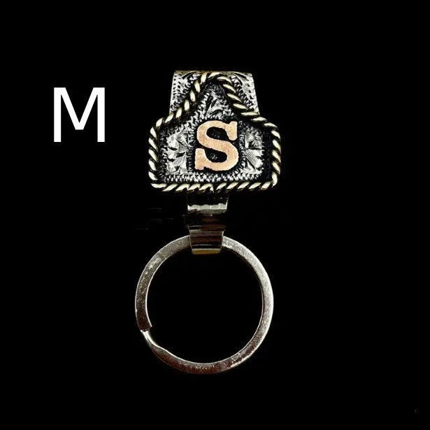 Handmade cow tag design metal keychain on a keyring, shown in one of many available colours.