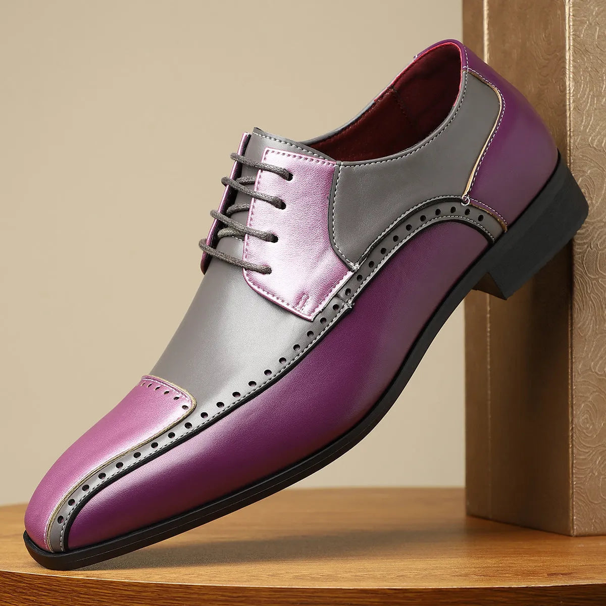 Men's black leather business casual shoes with stitching detail and a low-top design.