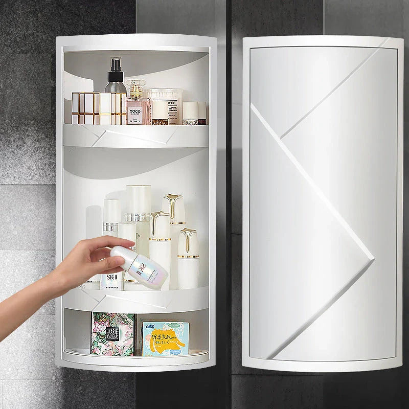 Rotating bathroom makeup storage rack with covered front, disassemblable base, and wall-mounting for space-saving organization.