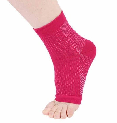 Anti-fatigue compression foot sleeve in black, red, or white, featuring moisture-wicking fabric and a heel hole for breathability.