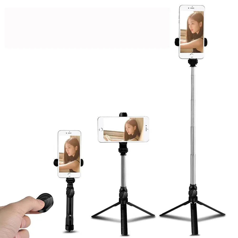 Black aluminium phone tripod stand with extended legs and a Bluetooth remote, holding an iPhone.