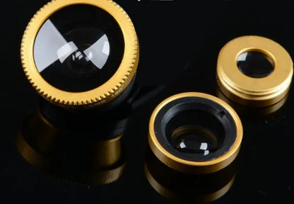 Three-in-one mobile phone camera lens kit showing fisheye, wide-angle, and macro lenses with universal clip in assorted colours.