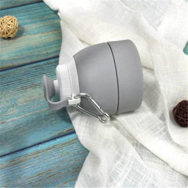 Collapsible silicone water bottle in various colours, perfect for travel and outdoor activities