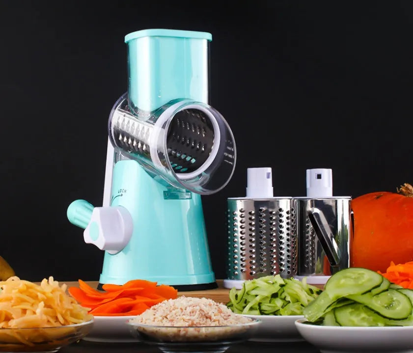 Blue multifunctional round mandoline vegetable slicer and cheese grater with stainless steel blades on a kitchen counter.