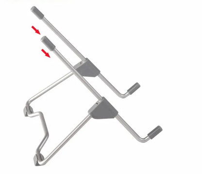 Grey aluminium and plastic adjustable stand holding a mobile phone on a wooden desk.
