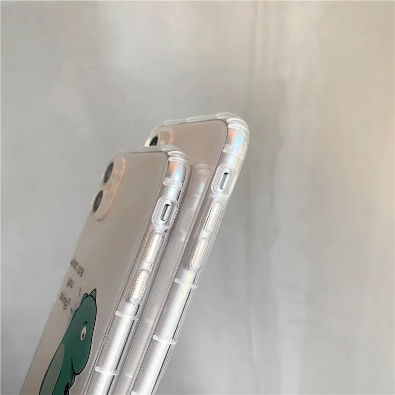 Transparent silicone and TPU iPhone case with airbag protection featuring a cute green dinosaur design.