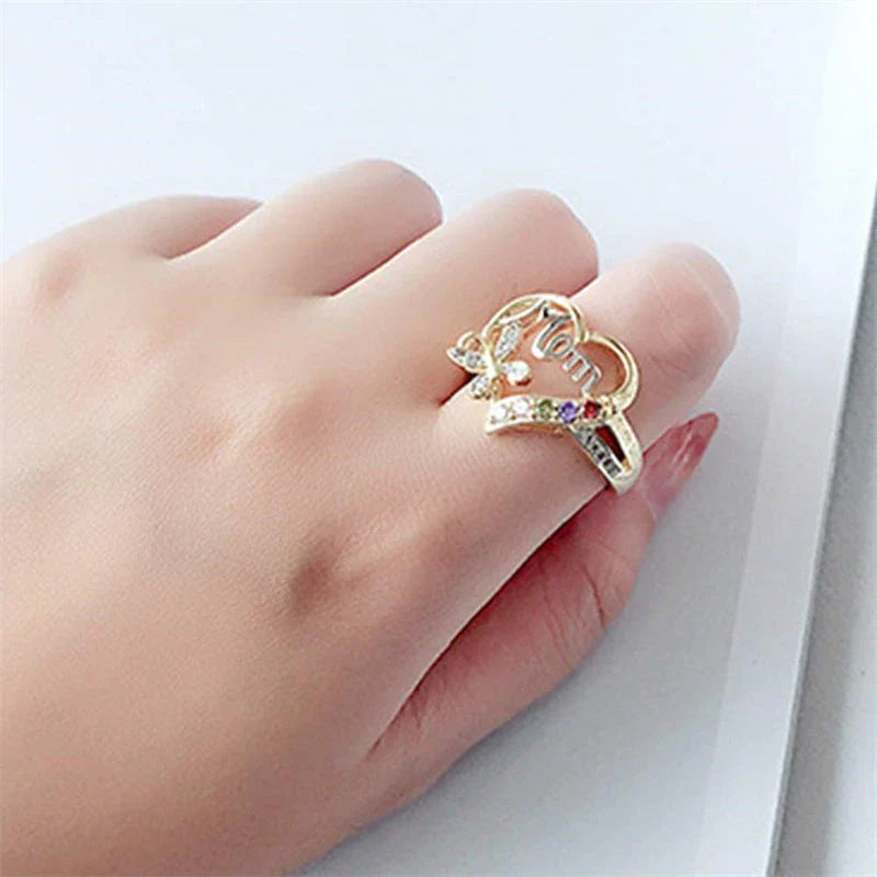 A shimmering heart-shaped jewelry set with a multicolor rhinestone design, including a ring and coordinating necklace, a thoughtful Mother's Day gift.