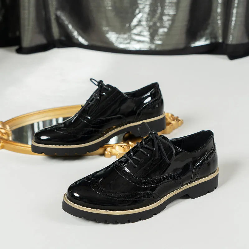 Women's black sequin lace-up loafers with a wedge heel and round toe