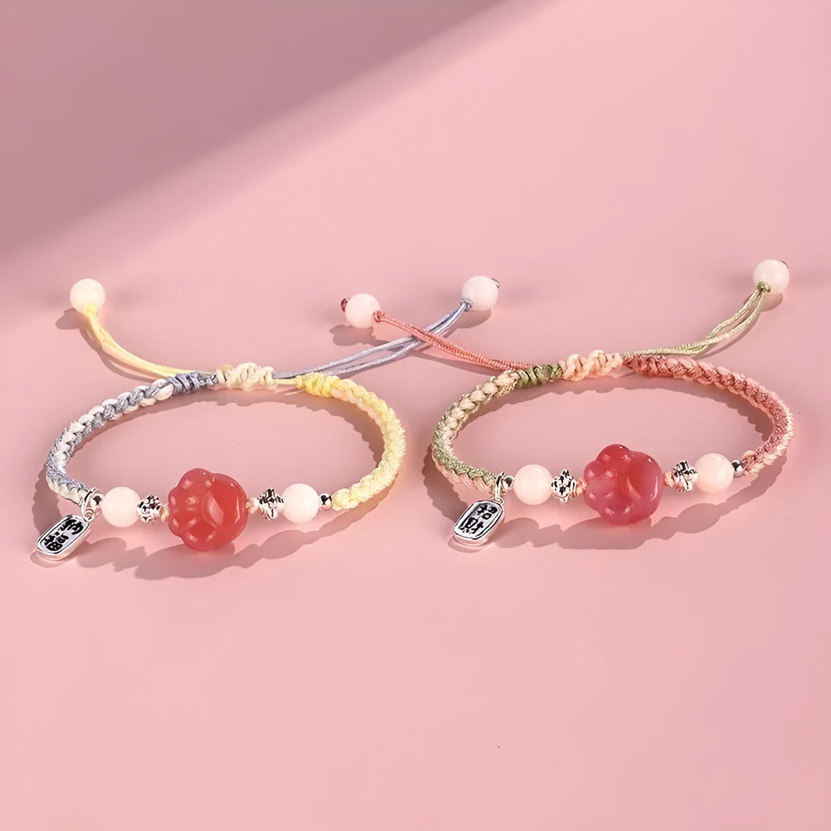 Handmade red cat's paw charm bracelet with glass beads in pink or yellow woven design
