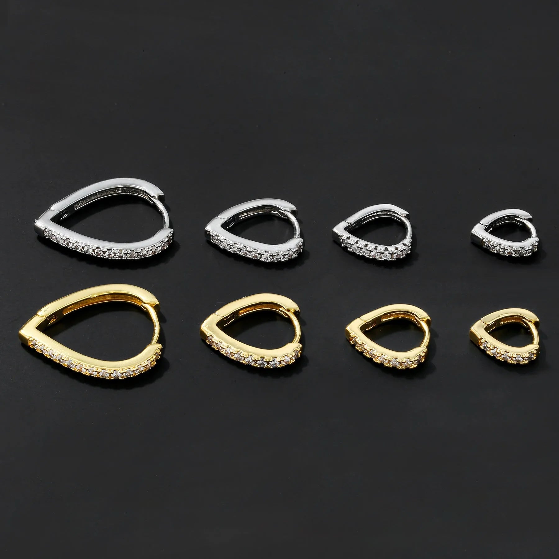 Copper geometric heart ear clip with electroplated gold finish, showing love design and net red wind style for summer accessories