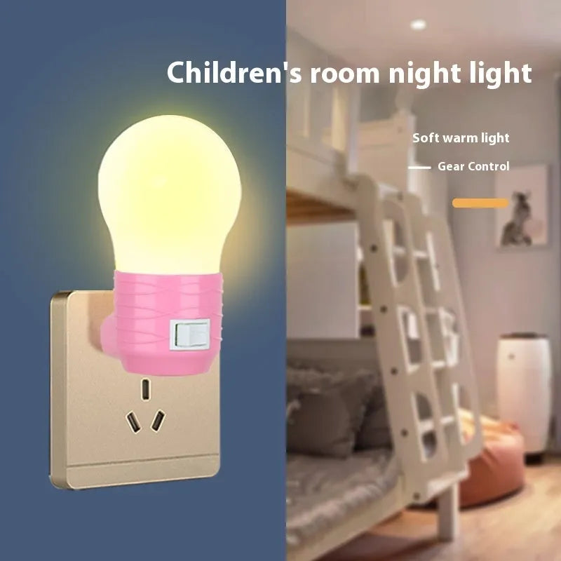 Plug-in bedside baby night light in white, blue, or pink shell with round shape.