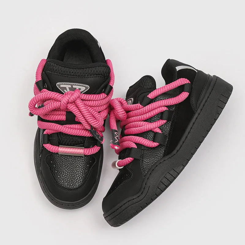 Low-top unisex casual shoes in denim blue with a round toe, thick rubber sole, and front lace-up closure.