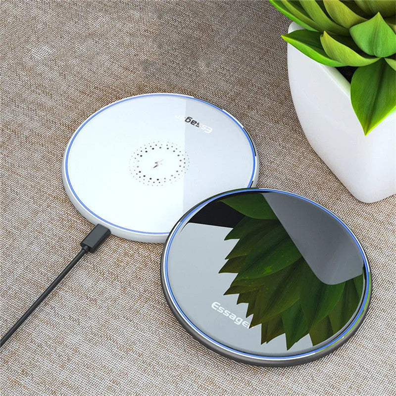 Black wireless charging pad with LED indicator light, measuring 10.1 by 7 centimetres