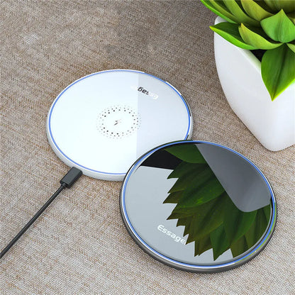 Black wireless charging pad with LED indicator light, measuring 10.1 by 7 centimetres