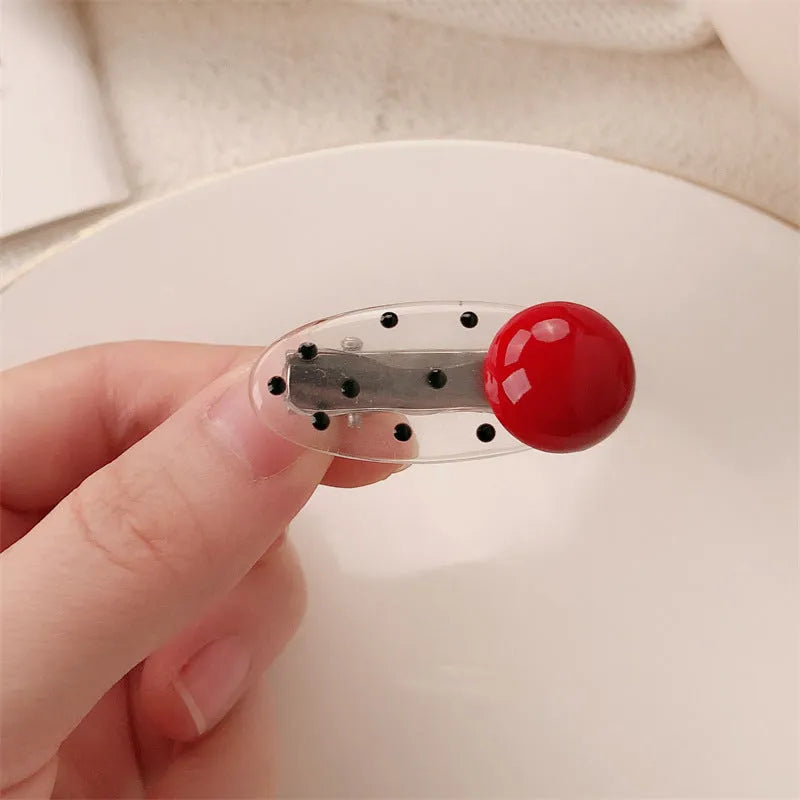 Red love heart-shaped hair barrette clip with retro white dots on a willow leaf-shaped base.