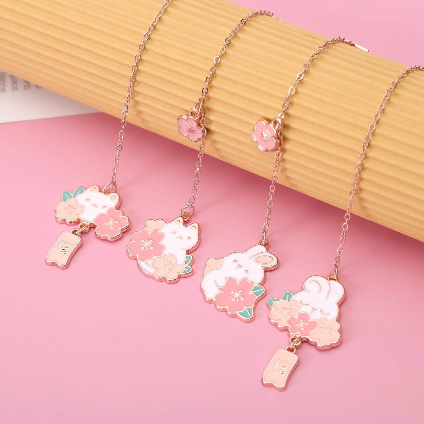 Metal bookmark holder with cartoon cherry blossom cat and rabbit designs