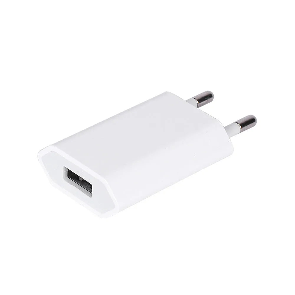 White USB travel charger with UK plug and a coiled Lightning cable for iPhone and iPad charging