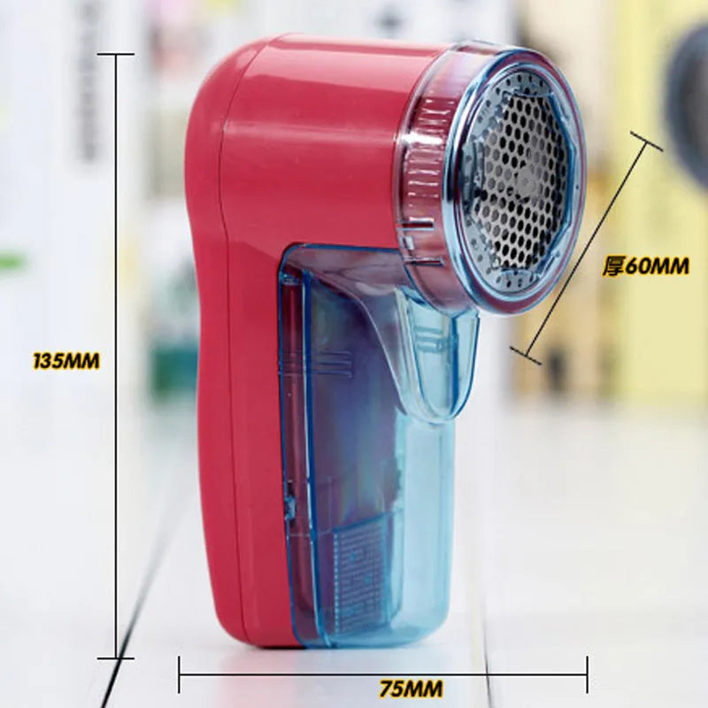 Handheld portable electric lint remover fabric shaver on a blue background.