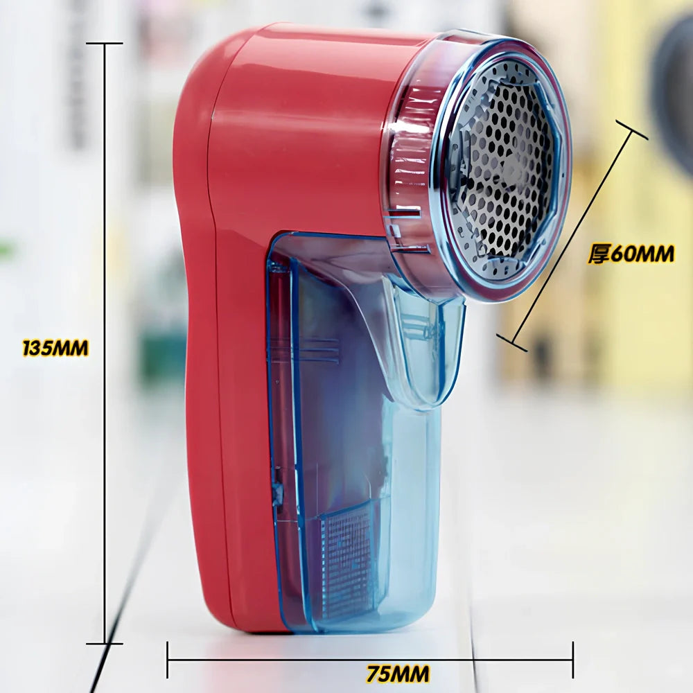 Portable electric lint remover measuring 11x16cm removing bobbles from blue woollen jumper